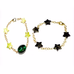 Armband - 2 st - svarta stjärnor / gröna stjärnor och en oval glaspärla