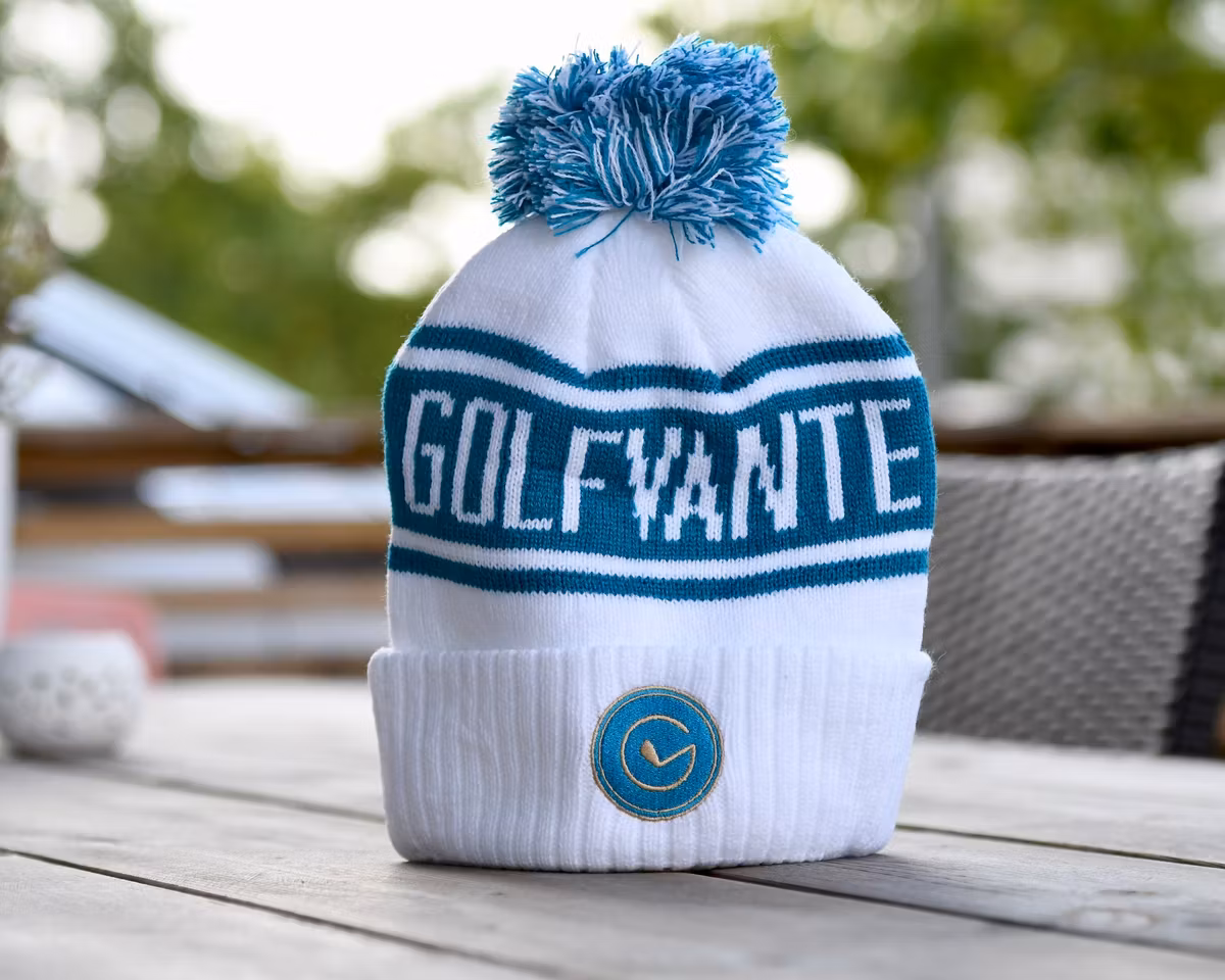 GOLFMÖSSA - BLÅ & VIT, MED KLASSISK TOFS OCH UPPVIK