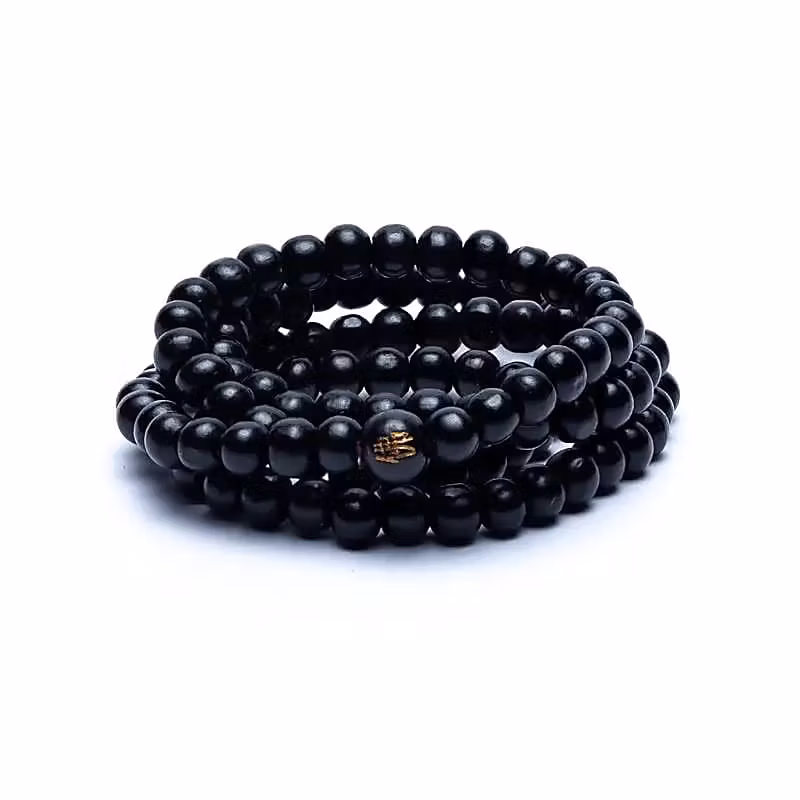 Mala/armband av svarta träpärlor