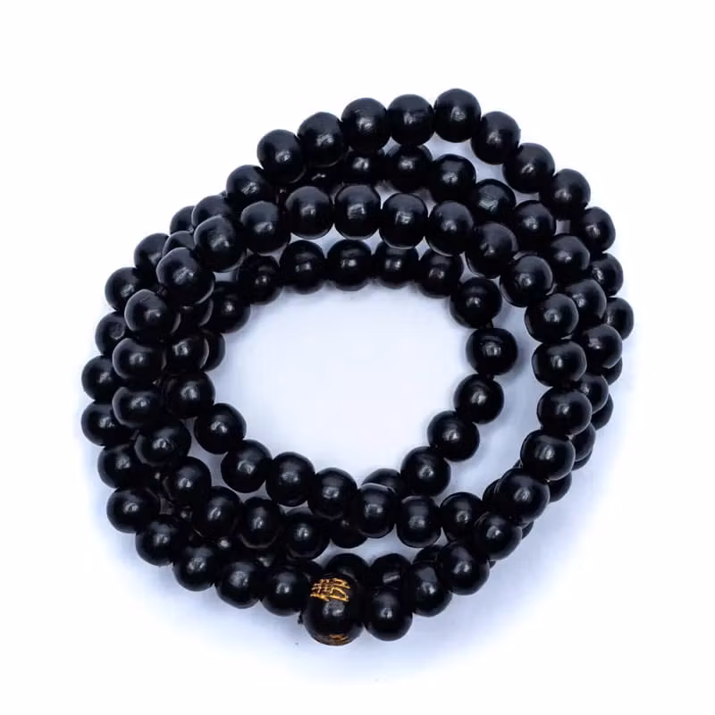 Mala/armband av svarta träpärlor