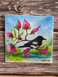 Hej lilla skata med magnolia under vingen.