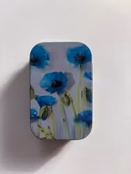 Plåtburk. Blå vallmo.