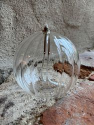 Oljelampa rund 13 cm. Klarglas med vågmönster.