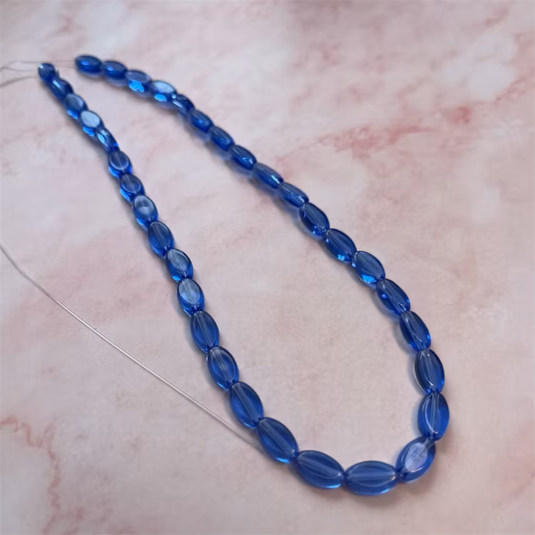Ehawa - Glas, oval, klar mörkblå, 6x9mm