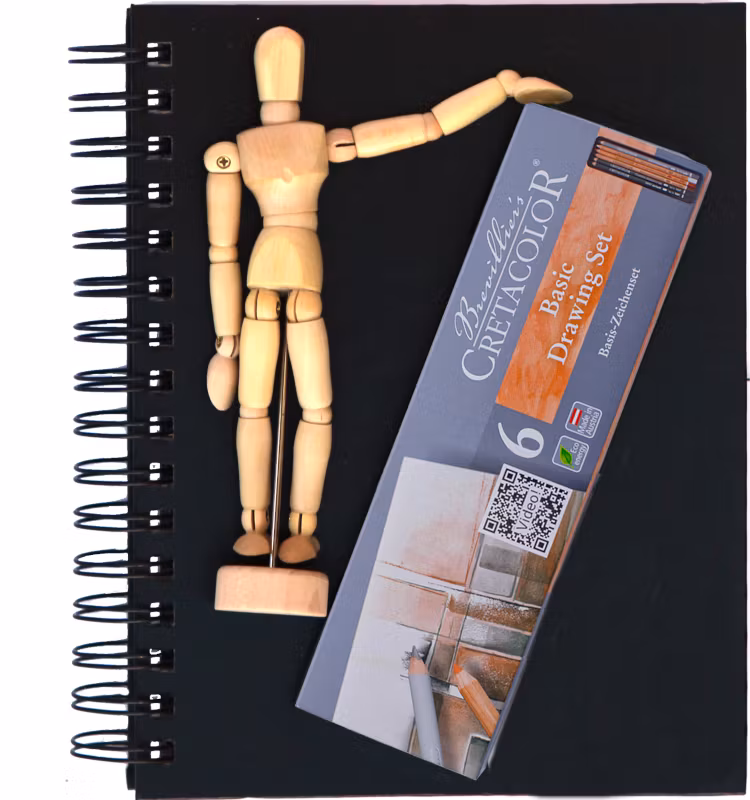 Block med modelldocka och pennor