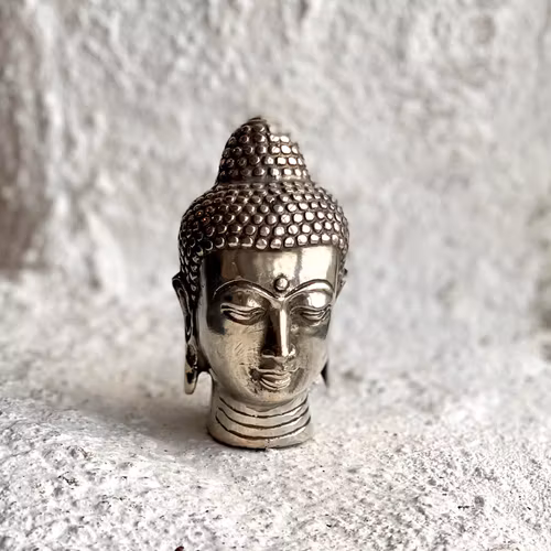 Liten Buddha staty i brons