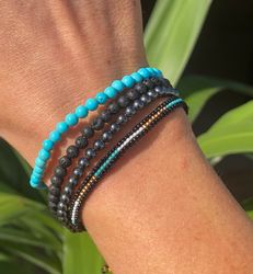 Armband miyuki pärlor turkos/svart/guld/vit