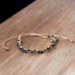 Armband blomma guld/svart