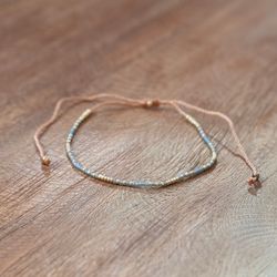 Armband guld/grå