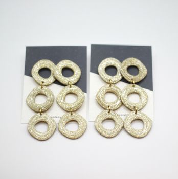 Uneven circle (guld/glitter)