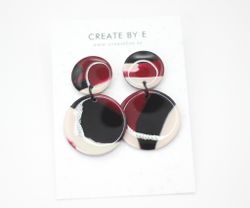 Glossy circle (svart/vinröd melerad)