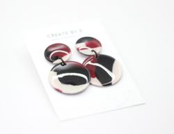 Glossy circle (svart/vinröd melerad)