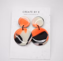 Glossy circle (svart/orange melerad)