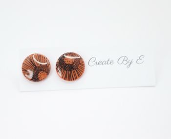 Glossy studs (orange/mönster)
