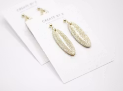Oval (guld/glitter/gloss)
