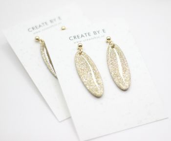 Oval (guld/glitter/gloss)