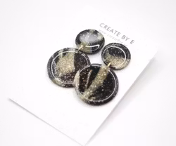 Glossy circle (svart/guldglitter/gloss)