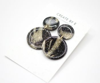 Glossy circle (svart/guldglitter/gloss)