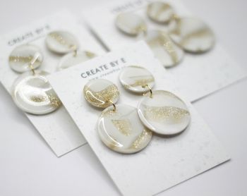 Glossy circle (vit/guldglitter)