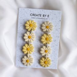 Blommor på rad (vit/gul)