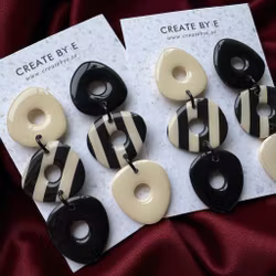 Dangle (svart/cremevit gloss)