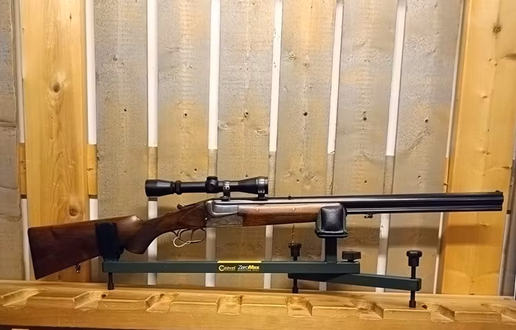 Kombigevär Merkel Mod 210E, Kal 12/6,5x57R, Hakmontage, Kikarsikte och vapenkoffert