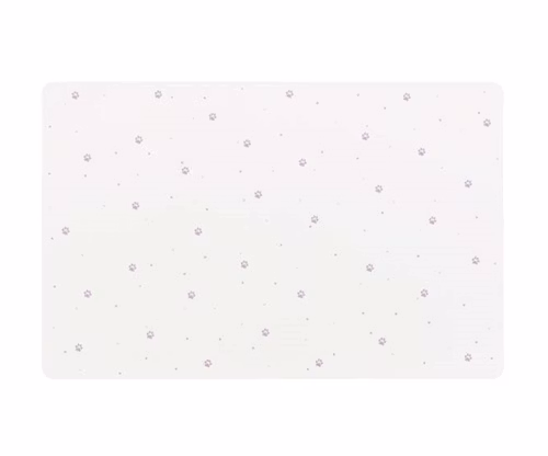 Ett matskålsunderlägg med tassavtryck.