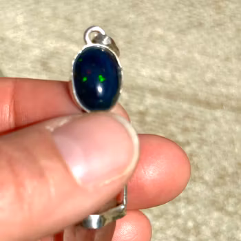 Black opal with double terminated pink Lemurian