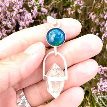 Dragons eye- black opal with double terminated clear quartz.