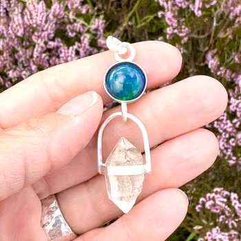 Dragons eye- black opal with double terminated clear quartz.