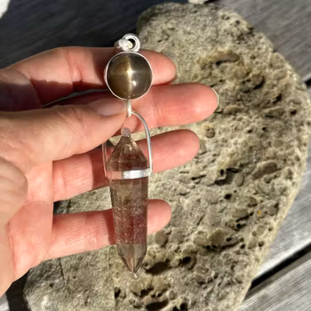 Raa- bringer of the light. Star sunstone with Smokey citrine Vogel.   Masterpiece
