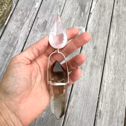 Cosmic love, embodying the Dragon energy and love through the field. Rose quartz with double terminated Lodolite