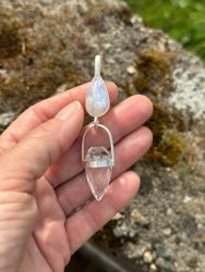 Athena and the white dragon- Rainbow moonstone with Clear Quartz Dragon egg.