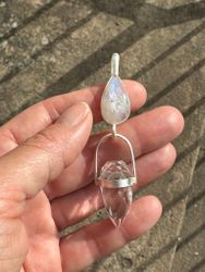 Athena and the white dragon- Rainbow moonstone with Clear Quartz Dragon egg.