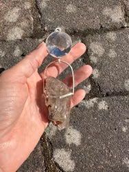 Silver wolf light portal- clear Quartz with amazing Rutilated Quartz with a raw side.