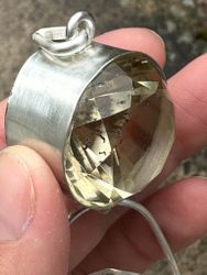 Dragon of life giving and light giving- Dark citrine with magical inclusions with clear Quartz dragon egg with massive rainbows.