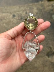 Dragon of life giving and light giving- Dark citrine with magical inclusions with clear Quartz dragon egg with massive rainbows.