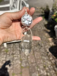 Light portal of the hidden lights of cosmos Clear Quartz light portal with  Enhydro Quartz from the Himalayas with moving sand/stardust in the water.