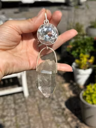 Light portal of the hidden lights of cosmos Clear Quartz light portal with  Enhydro Quartz from the Himalayas with moving sand/stardust in the water.