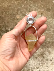 The golden orb- clear quartz with Libyen Tectite