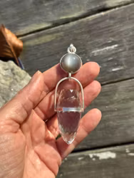Womb of Creation – The Priestess of Darkness and Light  Black natural moonstone with clear quartz dragon egg