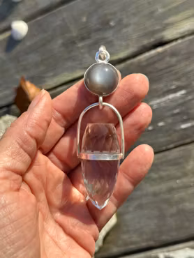 Womb of Creation – The Priestess of Darkness and Light  Black natural moonstone with clear quartz dragon egg