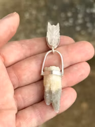 Dragon of Loving Light Codes - rose Quartz dragon with an ocean of small quartz crystals