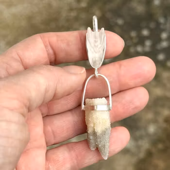 Dragon of Loving Light Codes - rose Quartz dragon with an ocean of small quartz crystals