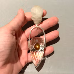 Skull of Freja- Quartz with high-frequency Dragon Egg and Natural Sunstone from Sweden