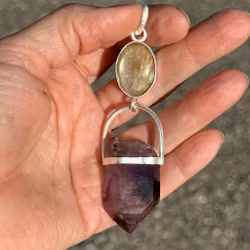 The White Flame- White Sapphire with Double-Terminated Enhydro Brandenberg Quartz