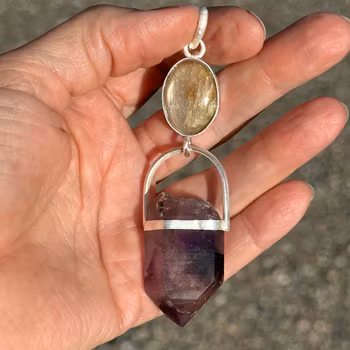 The White Flame- White Sapphire with Double-Terminated Enhydro Brandenberg Quartz