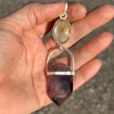 The White Flame- White Sapphire with Double-Terminated Enhydro Brandenberg Quartz