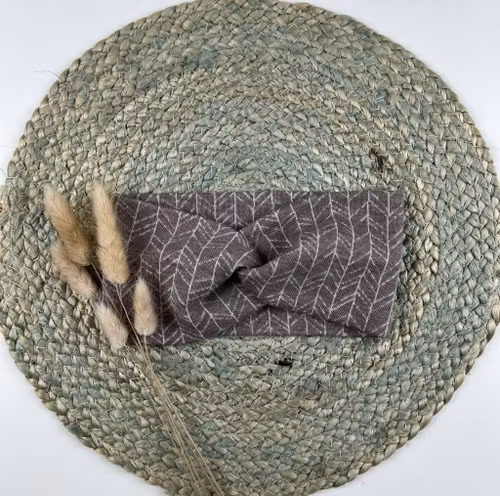 Snurrepannebånd beige Pil