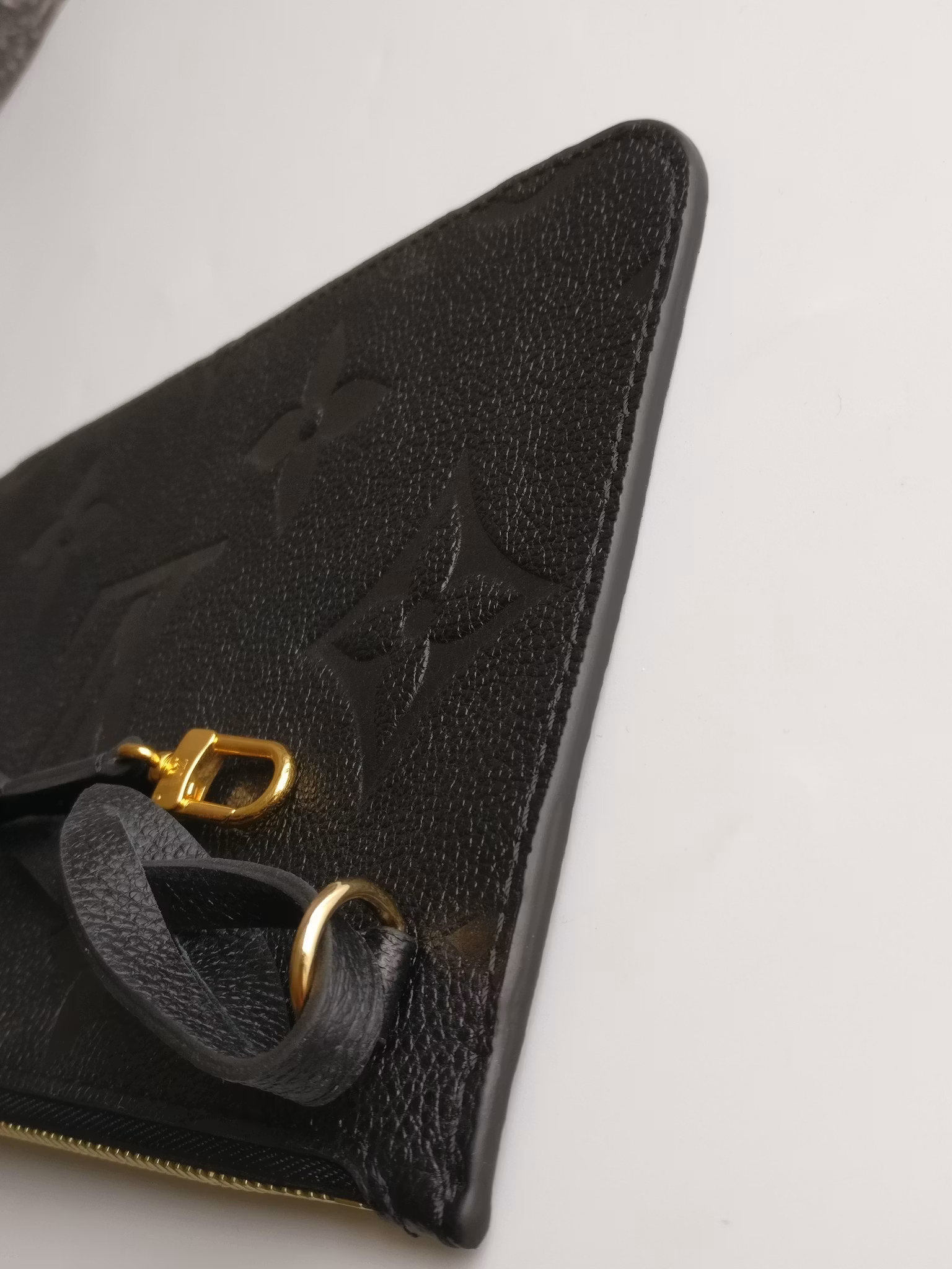 Louis Vuitton Neverfull empreinte clutch